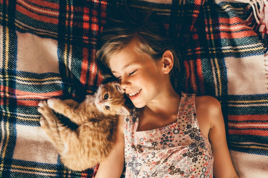 Girl Playing With Cat